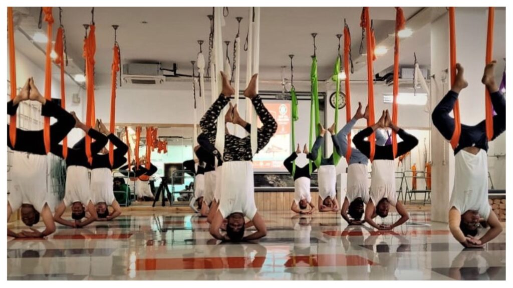 Longest Group Performance of Hanging Headstand Pose