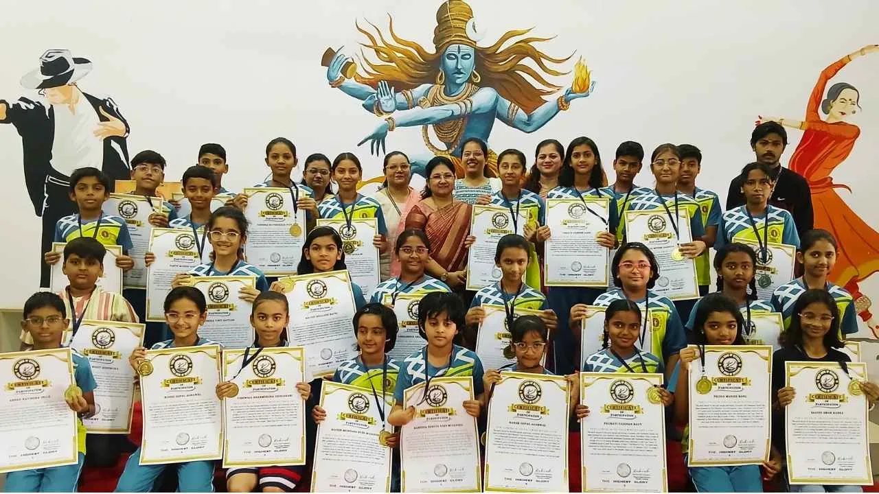 Young participants holding Yoga Book of Records certificates for a Mass Yoga World Record organized by Akhil Bhartiya Yoga Mahasangh